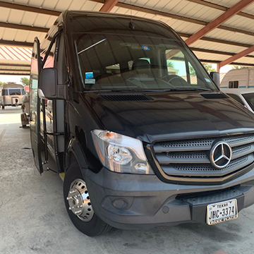 a parked sprinter van in a garage